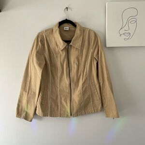 90’s inspired tan jacket with front zipper and white stitching